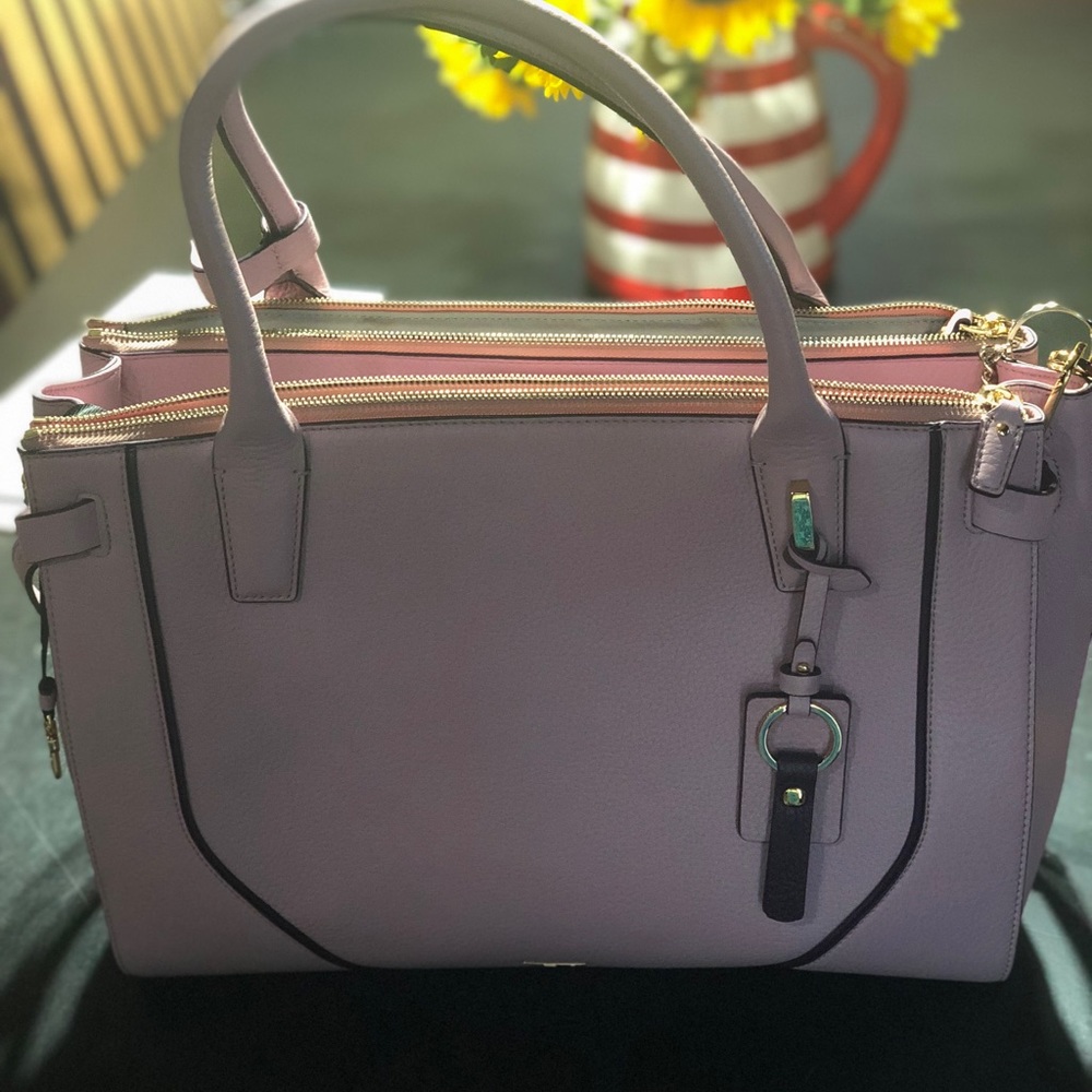 Beautiful new Tumi bag. Does not meet my needs.